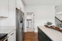 This view looks toward the laundry room. The washer and dryer will convey with the property.