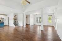 This view captures a lot -- the entry, dining area, mudroom, stairway to upstairs and the kitchen area to the left.
