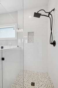 This shower is so nice...the tile work is so bright and clean!