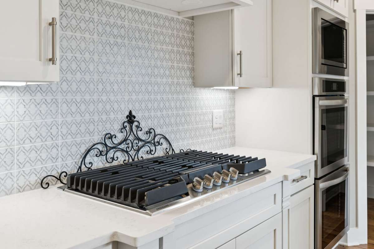 Beautiful Counters & Tile Work Thru-out this home, Built in Stoves & Micro