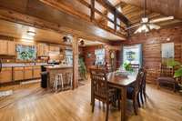 Combo living/dining/kitchen with balcony overlooking area