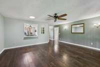 Family room has a pass through to the kitchen with space for a couple of bar stools.