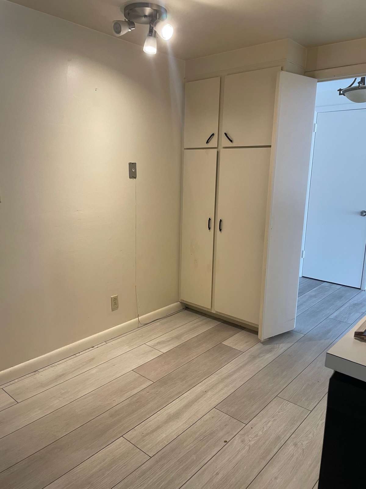 Room in kitchen for breakfast table.  Pantry cabinets.