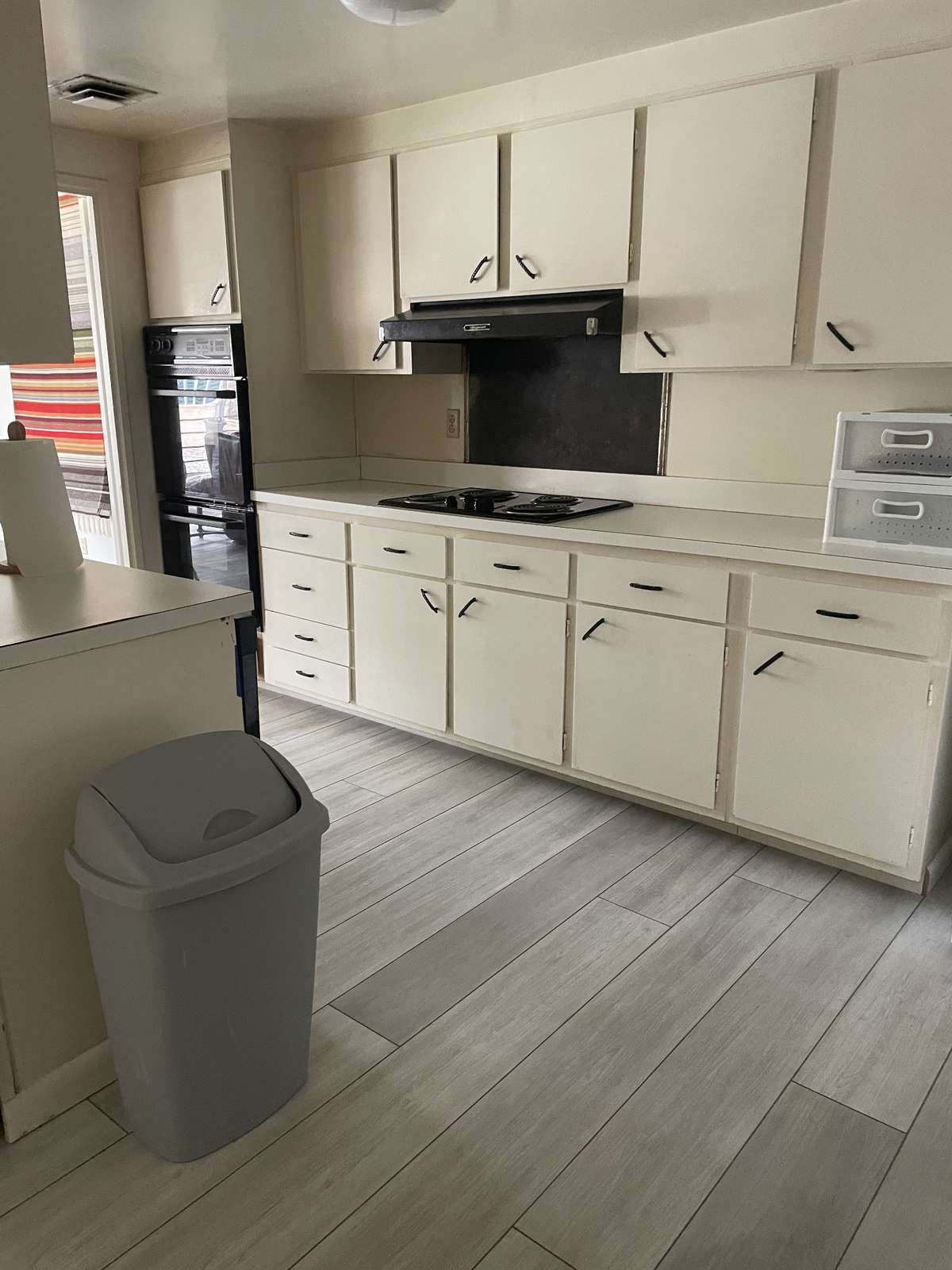 Kitchen has many cabinets.