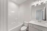 Second full bath - *Photo from a completed unit of the same floorplan, other color options available