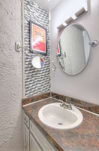 Half bath also has a tile floor.