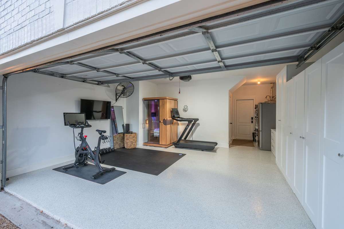 Wellness and workout zone-garage converted with expoxy flooring. Workout equipment and sauna are negotiable. Built in cabinetry make for an organized space!