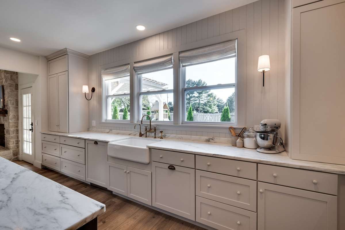Kohler farmhouse sink overlooking private backyard-new windows too!