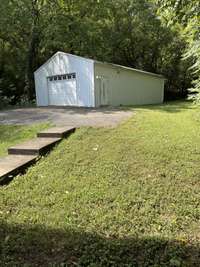 Huge shop building with steps that lead from the home
