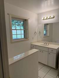 Half bath located off the den