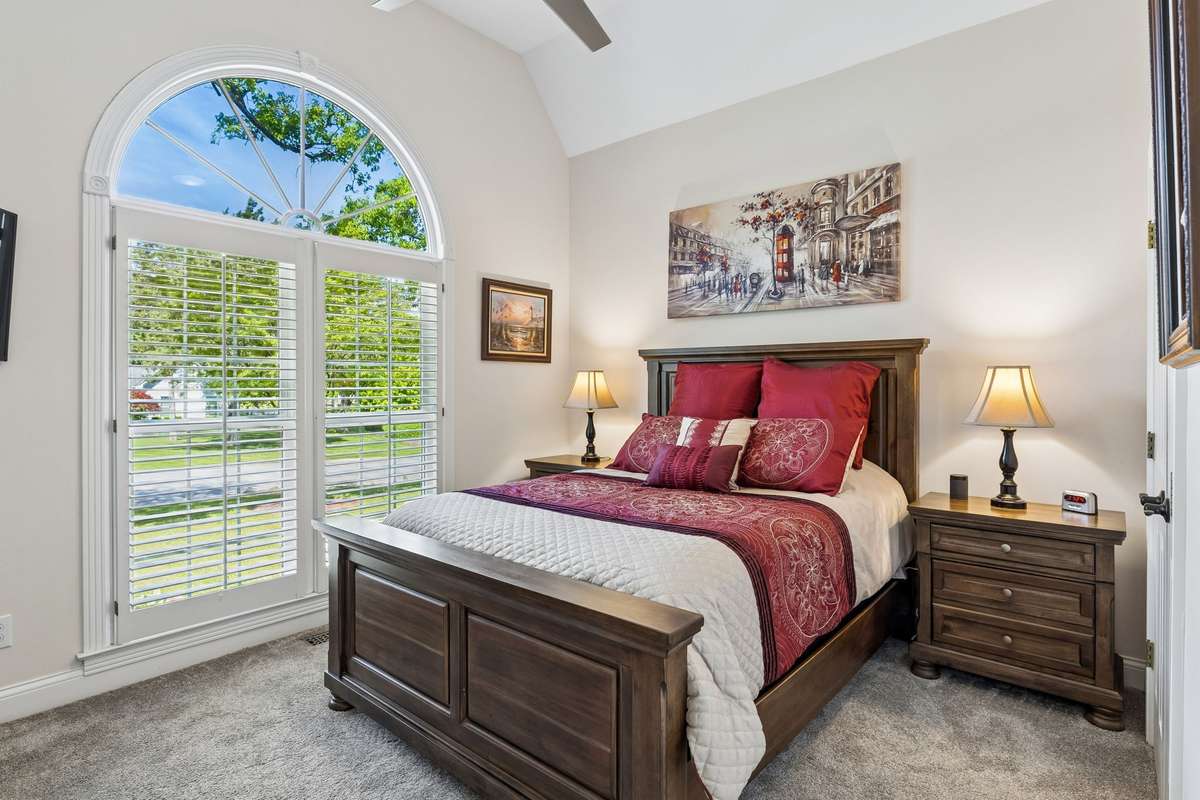 Second bedroom downstairs with vaulted ceiling, oversized palladium window with plantation shutters, and ample closet space! 2230 Northwoods Drive, Murfreesboro, Tn 37130