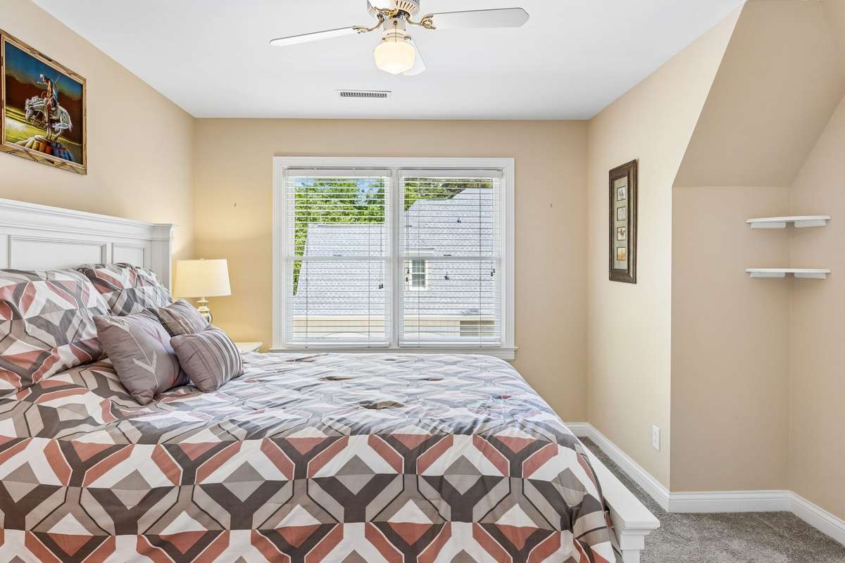 Third bedroom with double window, carpet flooring & ceiling fan. 2230 Northwoods Drive, Murfreesboro, Tn 37130