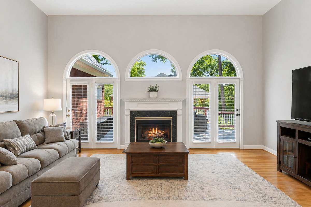 Large living room with three halfmoon windows, gas fireplace & outdoor access. 2230 Northwoods Dr. Murfreesboro, TN 37130