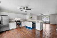 No wasted space here—this kitchen gives you serious counter room, tons of cabinets, and a full view of the living area so you’re never cut off from the action.