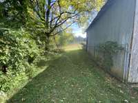 Pasture behind barn offers the majority of the private rolling land