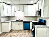 Modern stainless steel appliances add style and function to this fresh space.