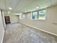 Spacious and inviting family room with plenty of room to relax, entertain, and enjoy time together—perfect for cozy nights in or hosting guests!