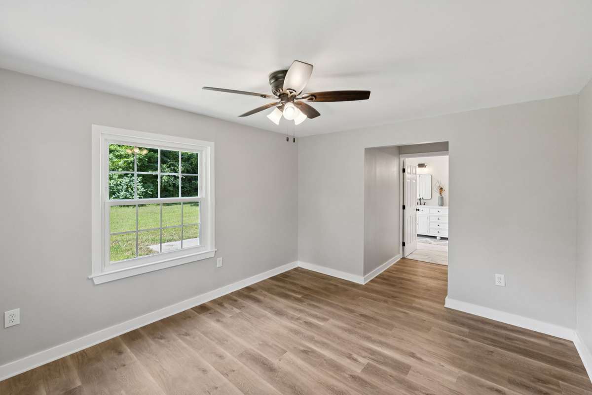 This view shows the Primary Suite with large doorways into the Bedroom and Bathroom