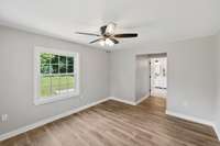 This view shows the Primary Suite with large doorways into the Bedroom and Bathroom