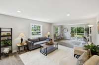 The Open Floor plan continues with the Living room and Flex space currently set up as an office