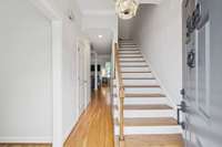foyer with breakfast nook and kitchen left