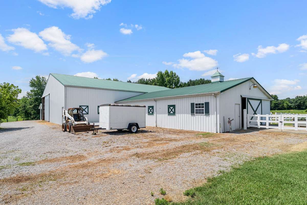 Hold your horses!  And we have just the place ... this 7-stall stables and tack room! AND, an indoor riding/training arena, to boot!  Everything you need in ONE place!
