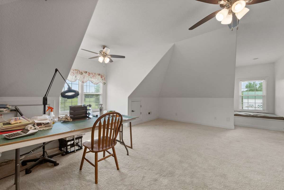 Huge bonus room over garage features a full bathroom and tons of storage