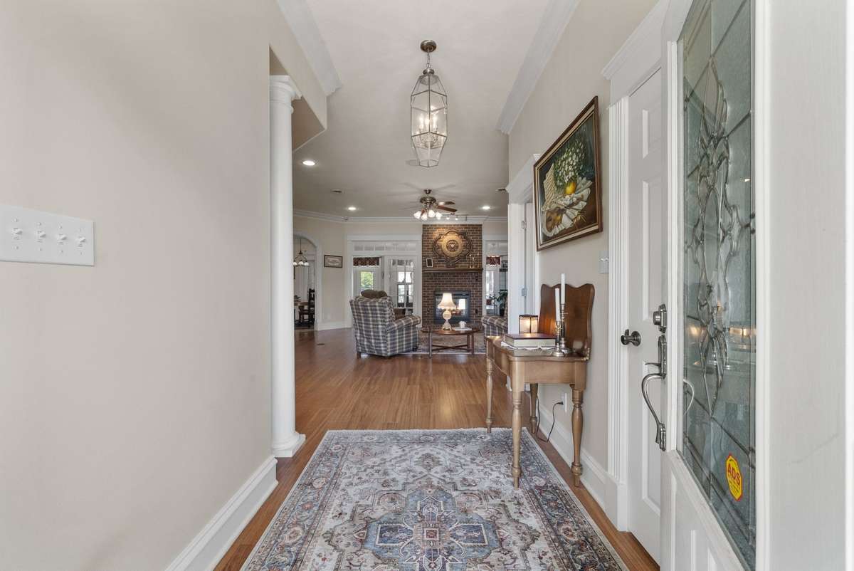 The entryway into the living room features hardwood floors