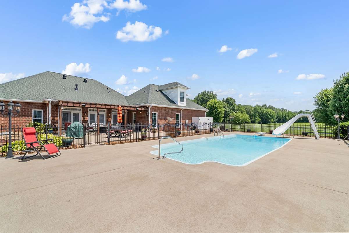 Completely fenced 15x35 chlorine pool with diving board and slide!