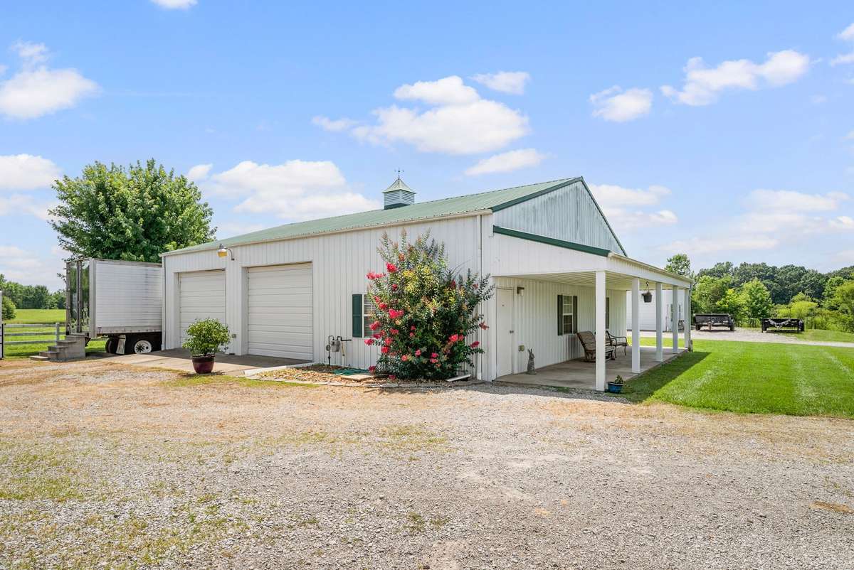 40x50 detached garage with 2 oversized bays, a separate office, and a bathroom.  This is ideal for a home-based business.  No need to rent commercial space, you can have everything right at home. There is also a canning kitchen located inside!
