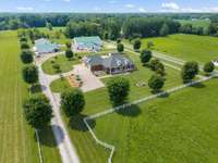 Welcome to Your Private Equestrian Oasis! Nestled on 14.75 beautifully fenced acres, this stunning 3,650 sq ft estate offers the perfect blend of luxury living and country charm.