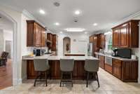 Huge kitchen with custom cabinets, spacious granite countertops, 2 (yes 2!) dishwashers, trash compactor, gas stove, built-in oven, 2 compartment sink, AND an island sink