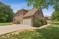 2805 Wynthrope Hall, Has a 2+ car garage and an oversized drive.  Garage has a pedestrian door for easier garage access.  Sidewalk to front entry or back entry.