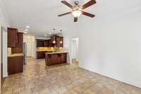 View of the kitchen from the smaller family room or eat-in dining.  See the short hall way to the second and third bedroom on the main floor.  Full bath between these rooms.