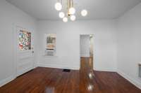 Enter to this sunny living room with soaring ceilings and huge front yard between your window and Riverside Dr. You will fall in love with the original wood floors!