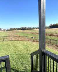 Fenced backyard & Stained deck.   Ready for enjoyment...