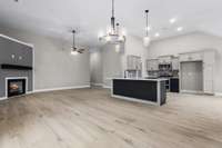 View of Formal Dining Area, Great Room with Corner Fireplace & Well Planned Kitchen....