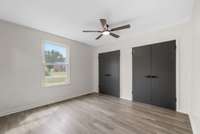 Primary Bedroom with 3 closets. Don't miss the closet behind the door as you enter the bedroom... Enough wall space for the KING sized bed