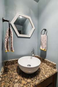 Primary half bath. Granite and new fixtures.