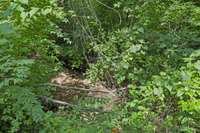 A creek runs along the back of property for those quiet afternoon yard walks.