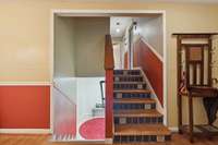 Upstairs is 3 bedrooms and a full bath.