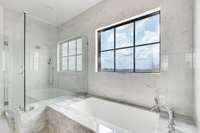 Primary bath undermount soaking tub and expansive shower.