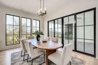 Wall of glass that opens to a private covered porch.