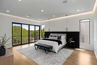 Upstairs to the primary suite with LED ceiling feature, headboard LED and balcony.