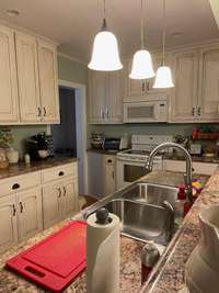 Completely new kitchen with bar counter and custom made cabinets