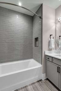 Spacious Third Bathroom with Custom Tiled Shower to the Ceiling