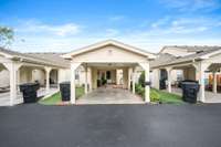Park under the carport and conveniently walk straight into the back.