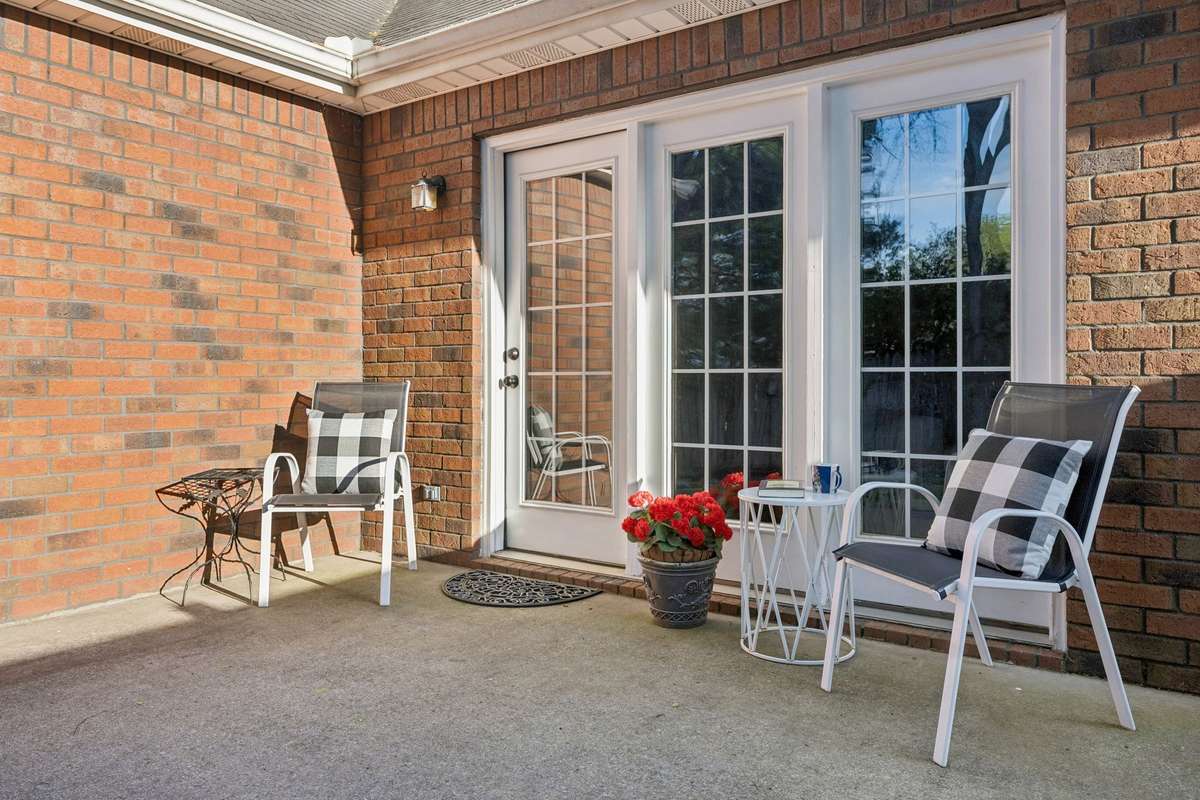 The private patio and backyard are perfect for year-round enjoyment.