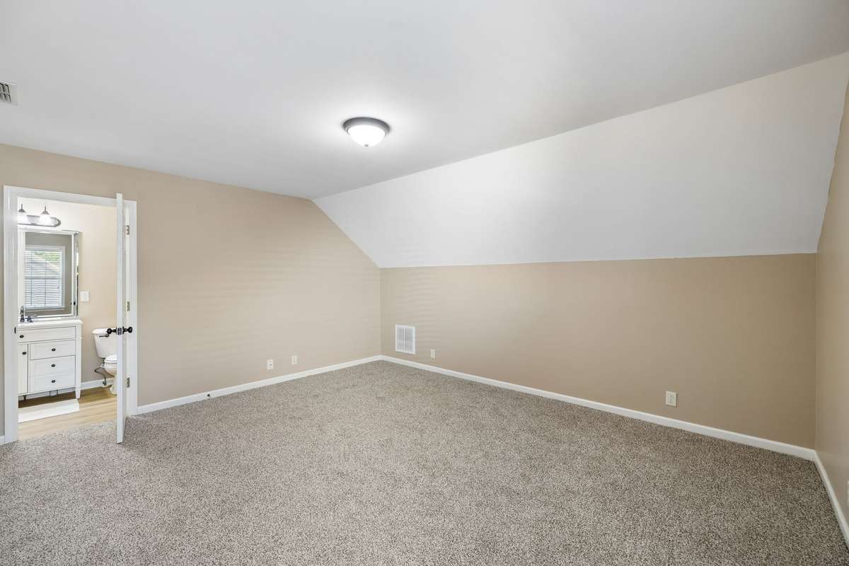 The upper level offers a large 16x14' Bedroom #3 with ensuite bathroom and walk in closet.