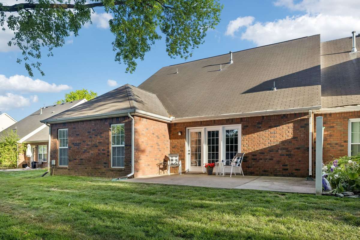 The private patio and backyard are perfect for year-round enjoyment.